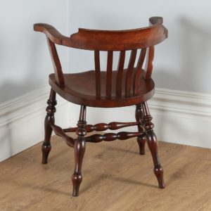 Antique English Victorian Mahogany Smokers’ Bow Office Desk Armchair by J.W. Read & Co. (Circa 1880)