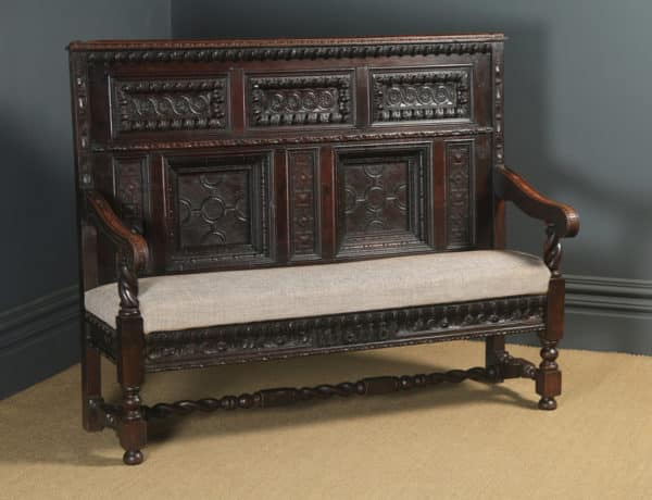 Antique English 17th Century Style Victorian Oak Carved High Back Panelled Upholstered Settle (Circa 1870)